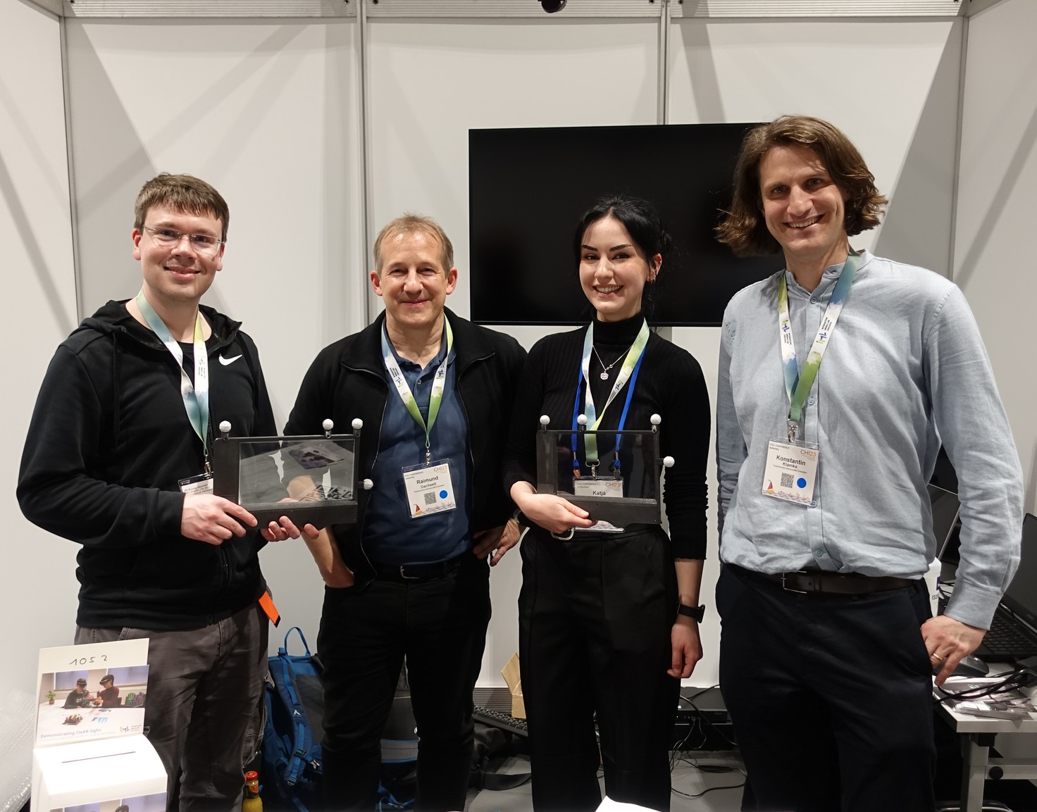 CleAR Sight demo booth at CHI 2023. From left to right: Wolfgang Bueschel, Raimund Dachselt, Katja Krug and Konstantin Klamka.